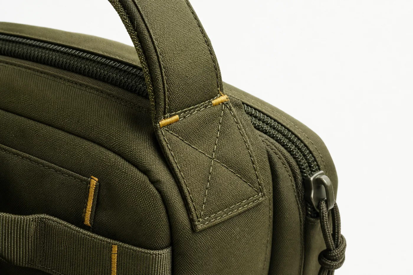 Close-up of reinforced stitching and zipper construction on travel backpack